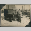 Nisei soldier poses in front of jeep (ddr-densho-397-290)