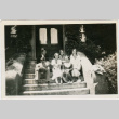 Photo of group sitting on stairs (inside program) (ddr-densho-341-90)