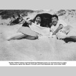Man and woman sitting on beach (ddr-ajah-6-521)