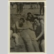Men on beach with woman built of sand (ddr-densho-201-193)