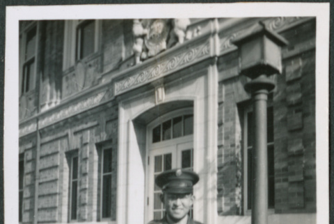 Man standing on steps of building (ddr-densho-434-488)