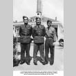 Three men standing outside building (ddr-ajah-2-768)