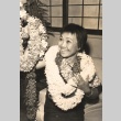 A woman holding leis (ddr-njpa-4-2264)