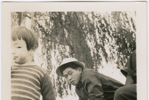 Boy and young man with cigarette (ddr-densho-329-773)