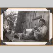 Smiling man with pigeons (ddr-densho-542-51)
