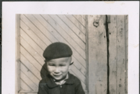 Boy wearing a cap sitting (ddr-densho-483-538)