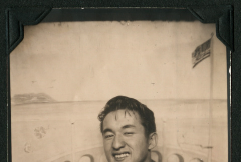 Walter Matsuoka poses in a letterman jacket (ddr-densho-390-67)