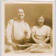 Man and woman standing by table (ddr-densho-426-2122)