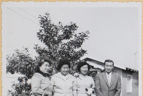 Three women and a man outside house (ddr-densho-522-55)