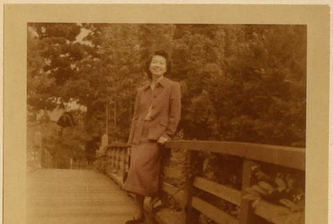 Ruth (Saitow) Kikawa on a bridge (ddr-densho-542-34)
