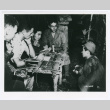 Philip Ishio and Arthur Uchiro interrogating a Japanese prisoner of war (ddr-densho-1007-397)