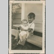 A boy holding a baby (ddr-densho-321-1029)