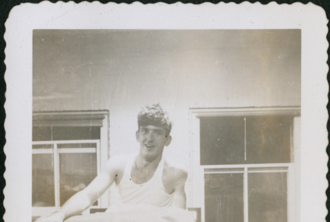 Man sitting on bunk (ddr-densho-434-474)