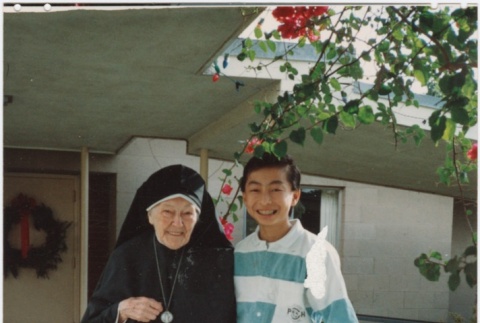 (Photograph) - Image of elderly nun with young man (Front) (ddr-densho-330-293-mezzanine-3f53bfcddc)