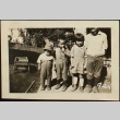 Four Nisei children in yard (ddr-densho-259-441)
