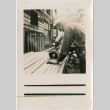 Man using circular saw (ddr-densho-426-1957)