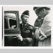 Three figures outside car (ddr-densho-1007-31)