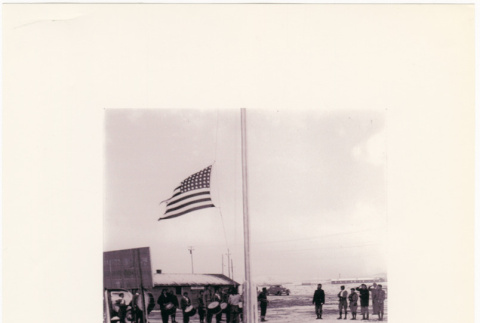 Group standing by flag pole with drum corps (ddr-densho-122-614)