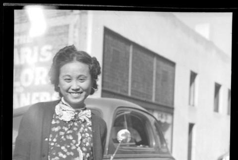 Woman standing next to car (ddr-densho-540-140)