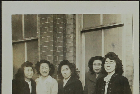 A group of women standing in front of a brick building (ddr-densho-328-540)