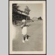 Baby rubbing their eyes (ddr-densho-433-1004)