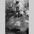Campers posing on a boulder (ddr-densho-336-81)