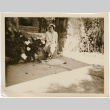 Tomoye (Nozawa) Takahashi sitting on steps (ddr-densho-426-1788)