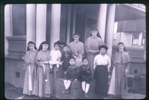 (Slide) - Image of Nuns and children on steps of Maryknoll (ddr-densho-330-6-mezzanine-18d971e3ba)