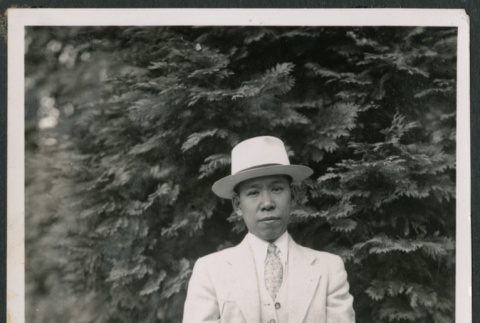 Photo of a man in a summer suit (ddr-densho-483-776)