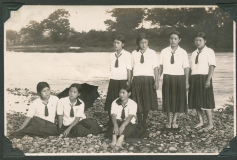 Group photo of seven young women in school uniforms (ddr-densho-483-354)