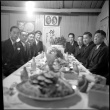 Group of men around banquet table (ddr-densho-426-2153)