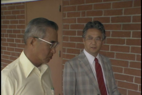 Shiro Tokuno & Mr. Matsumoto walking and talking (ddr-densho-1007-1649)