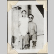 Man sitting on steps with young girl (ddr-densho-466-734)