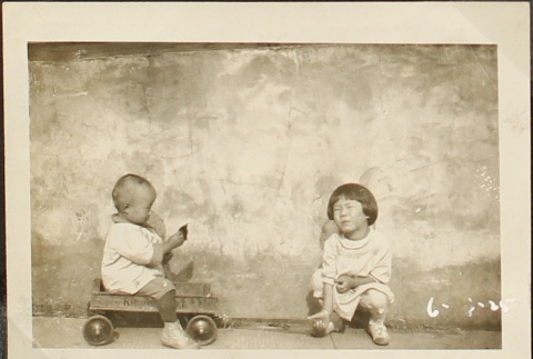 Nisei children pulling a wagon (ddr-densho-259-452)