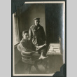 Soldiers pose by desk (ddr-densho-397-292)
