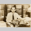 Ramon Grau seated at his desk (ddr-njpa-1-1789)
