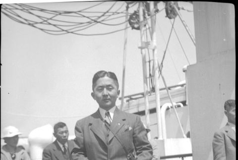 Man standing on deck of ship (ddr-densho-426-1980)