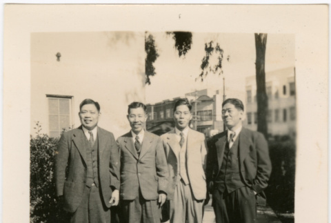 Four men standing on sidewalk (ddr-densho-426-1631)