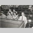 Miss Hawaii and others seated watching a baseball game (ddr-njpa-2-834)