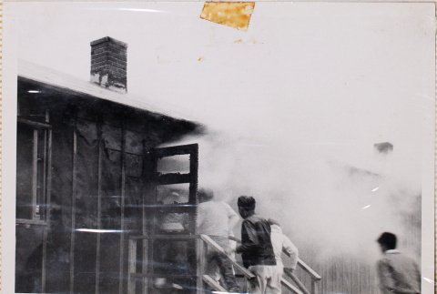 Men entering burning building (ddr-densho-464-9)
