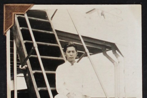 Man poses on the deck of a ship (ddr-densho-404-9)
