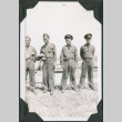 Four men in uniform standing on hill (ddr-ajah-2-143)