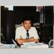 Man sitting at desk (ddr-densho-426-1350)
