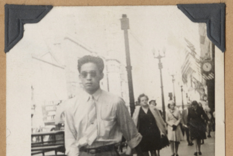 Man walking down the street (ddr-densho-542-129)