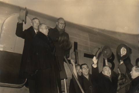 Buddhist priest and others outside an airplane (ddr-njpa-4-302)