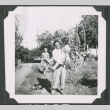 Three people in a garden (ddr-densho-471-176)