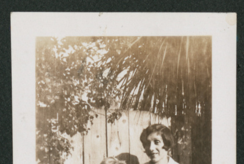 boy and girl next to fence (ddr-densho-378-779)