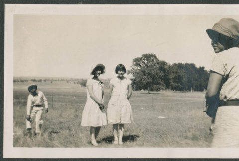 four people in a field (ddr-densho-378-458)