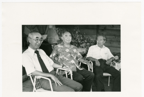 Three seated in white chairs (ddr-densho-1007-254)