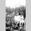Two children in a farm field (ddr-densho-2-18)
